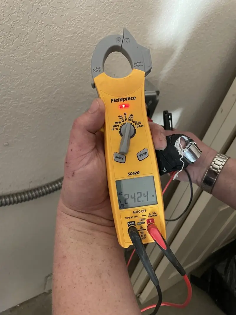 Voltage testing with clamp meter during Whole House Surge Protector in Sennett